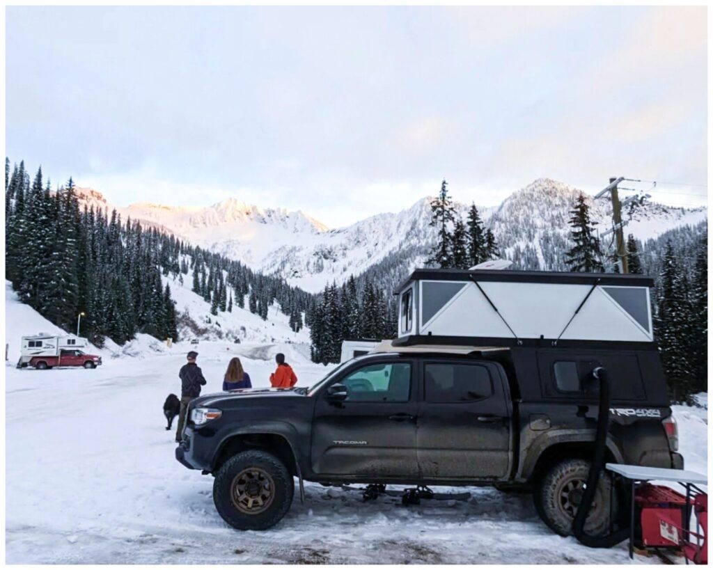 Four-season Hiatus Camper parked near mountain ski resort