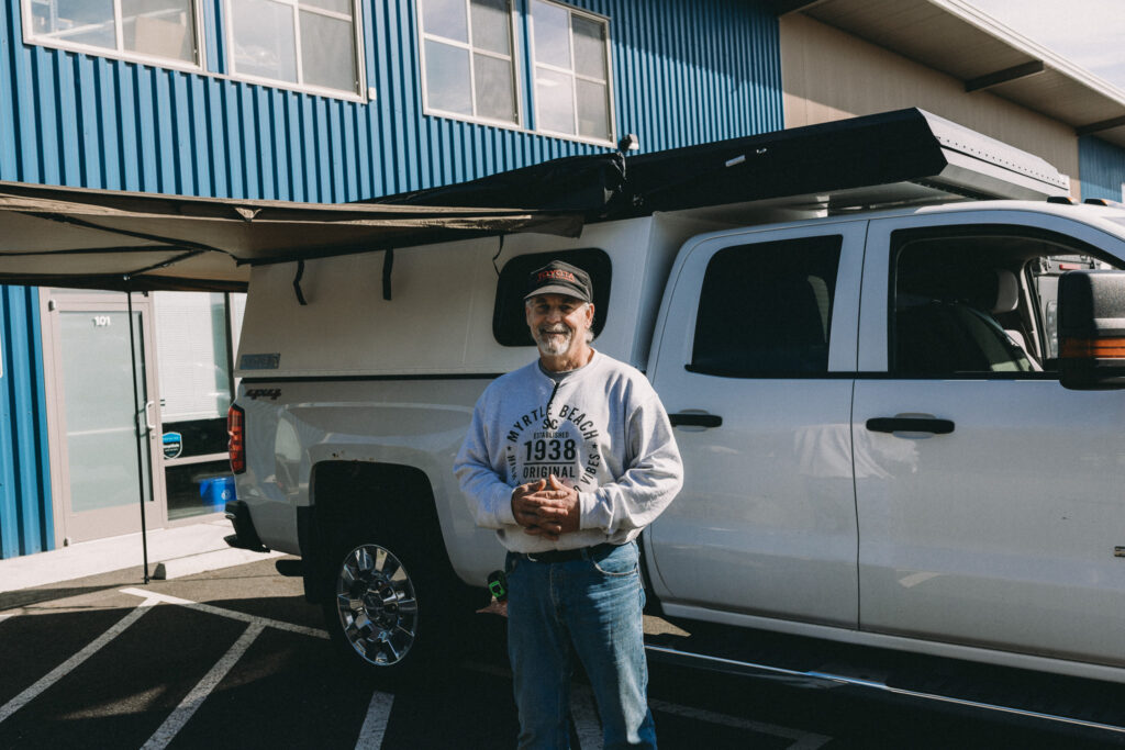 A happy customer with his new truck camper